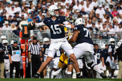 Penn State Football player Drew Allar passes the ball during a game