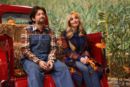 Nate Bargatze and Chloe Fineman sit on bed of a truck in SNL