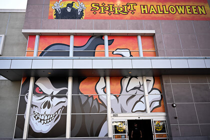 A view of the windows of a Spirit Halloween store front