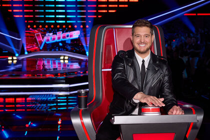 Michael Buble sits in his coach's chair during the Season 26 premiere of The Voice