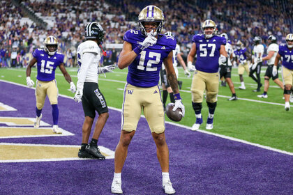 Denzel Boston celebrates a touchdown during a game between the Washington Huskies and the Weber State Wildcats