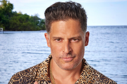 Joe Manganiello wears a leopard shirt in front of the ocean for Deal or No Deal Island Season 2.