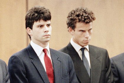 Lyle Menendez and Erik Menendez sit in court and listen to a judge