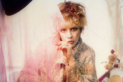 Stevie Nicks poses for a photo backstage in 1985 in Los Angeles, California