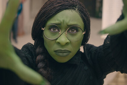 Elphaba (Cynthia Erivo) holds her hands up during a scene from Wicked