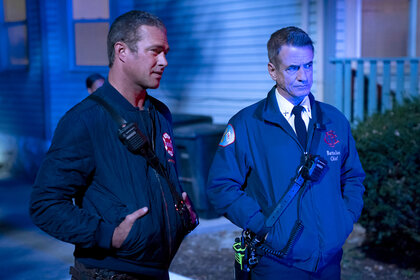 Kelly Severide and Chief Dom Pascal stand outside of a house on Chicago Fire Season 13 Episode 7