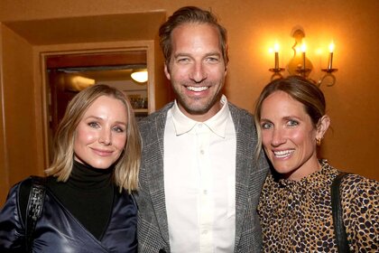 Kristen Bell, Ryan Hansen, and Amy Russell smile together.