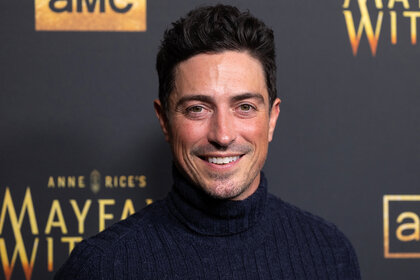 Ben Feldman wears a turtle neck to the red carpet of an event