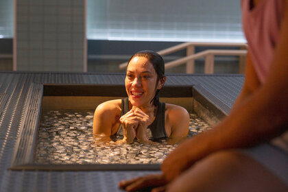 Katie Rodriguez sits in a ice bath on Brilliant Minds Season 1 Episode 10.