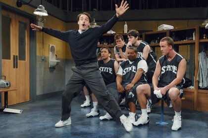 Coach (Will Forte) dances in front of his team (Jason Sudeikis, Fred Armisen, Bill Hader, Kenan Thompson, Peyton Manning)