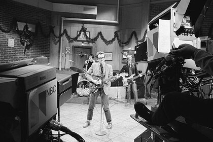 Elvis Costello performing on stage during Saturday Night Live Season 3, Episode 8.