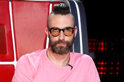 Adam Levine wears a pink shirt and glasses on The Voice Season 16 Episode 15A.