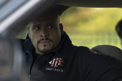 Joe Cruz (Joe Miñoso) sitting in a car in Chicago Fire Season 13, Episode 9.