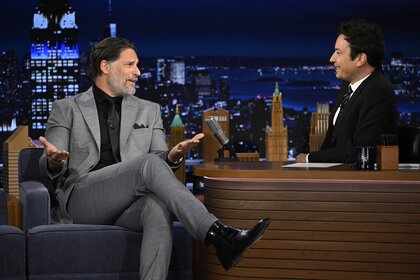 Joe Manganiello wears a grey suit and speaks to Jimmy Fallon on The Tonight Show Starring Jimmy Fallon Episode 2073.