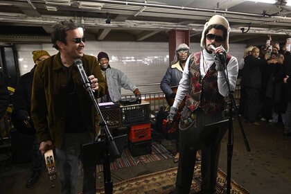 Bad Bunny and Jimmy Fallon perform in sunglasses for a surprise MTA subway performance.