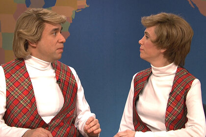 Fred Armisen and Kristen Wiig sit at the weekend update desk together on Saturday Night Live