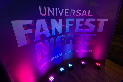 A purple Sign that says Universal FanFest Nights