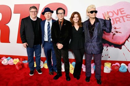 Sean Astin, Jeff Cohen, Ke Huy Quan, Kerri Green and Corey Feldman posing together at the Love Hurts Premiere.