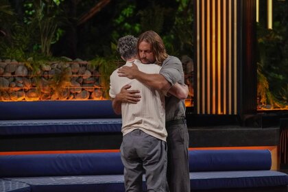 David Genat and "Dr. Will" Kirby hug on Deal or No Deal Island Episode 207.