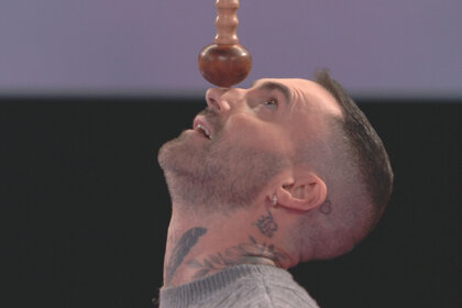 Adam Levine balances a stick on his nose on the voice season 27 episode 3