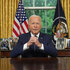 Joe Biden sits at his desk in the oval office addressing the nation