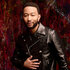 John Legend wears a leather jacket and poses for The Voice Season 27