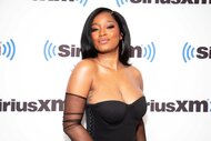 Keke Palmer visit SiriusXM Studios in a black dress.