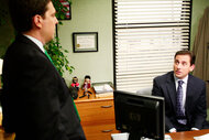 Ed Helms as Andy Bernard and Steve Carell as Michael Scott