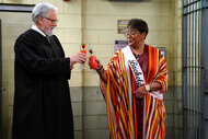 Dan Fielding (John Larroquette) and Roz (Marsha Warfield) make a toast