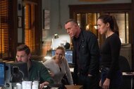 Adam Ruzek, Hailey Upton, Hank Voight, and Kim Burgess look a a computer in Chicago P.D. Episode 1006.