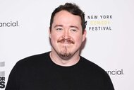 Shane Gillis smiles wearing a black shirt on the red carpet for the 17th Annual Stand Up For Heroes Benefit