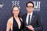 Robert Downey Jr. points to a smiling Susan Downey.