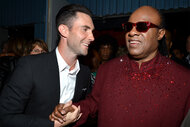 Adam Levine grabs Stevie Wonder hand and smile together