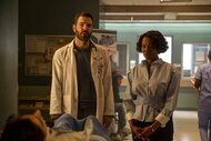 Dr. Oliver Wolf (Zachary Quinto) and Dr. Carol Pierce (Tamberla Perry) observe a patient in Brilliant Minds Episode 102.