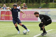 France's forward Frederic Villeroux (L) dribbles past France's goalkeeper Alessandro Bartolomucci during a public training session