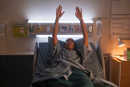 Jessie Williams has her hands up in a hospital bed on Brilliant Minds Season 1 Episode 2