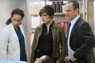 Dr Melinda Warner Olivia Benson Elliot Stabler stare at a body on law and order svu