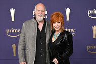 Rex Linn and Reba McEntire pose on the carpet of the 59th Academy of Country Music Awards