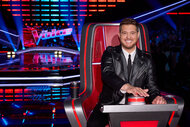 Michael Buble sits in his coach's chair during the Season 26 premiere of The Voice