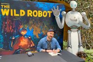 Peter Brown sits at a table during The Wild Robot DreamWorks Event