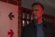 Dr. Josh Nichols (Teddy Sears) looking onward next to a sign in Brilliant Minds Season 1, Episode 4.