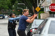 Kiana Cook (Toya Turner) and Officer Adam Ruzek (Patrick John Flueger) hold their guns out at a crime scene