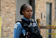 Kiana Cook (Toya Turner) stands at the scene of a crime