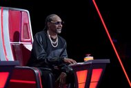 Snoop Dogg sits in a judge's chair on The Voice Season 26 Episode 10.