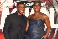 Zackary Momoh and Lashana Lynch laugh together on the red carpet at the Premiere of "The Day Of The Jackal"