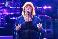 Lauren-Michael Sellers sings on stage on The Voice Season 26 Episode 14