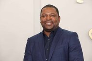 Mekhi Phifer smiles in a navy blazer.