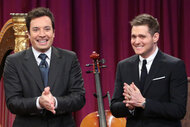 Jimmy Fallon and Michael Buble hold their hands together on Late Night with Jimmy Fallon 742.