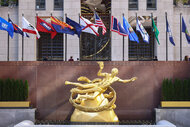 A view of the Statue Of Prometheus at Rockefeller Plaza in front of a water fountain