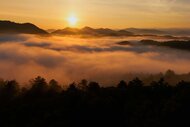 The sunsetting and mist surrounding the Great Smoky Mountains on The Americas Season 1, Episode 1.